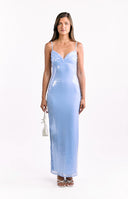 Model wears a blue sleeveless sequin maxi dress with a leg split perfect for prom.