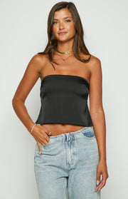 Front view of a black satin strapless top with a relaxed fit and slight flare at the hem