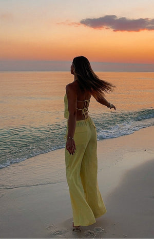 Beginning Boutique Vienna Yellow Pants yellow high-waisted wide-leg flowy pants with an elasticated waist