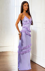 Side angle of a lilac satin maxi dress with tiered ruffles and thin spaghetti straps