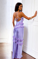 Rear view of a lilac satin maxi dress with criss-cross back straps and tiered ruffles down the skirt