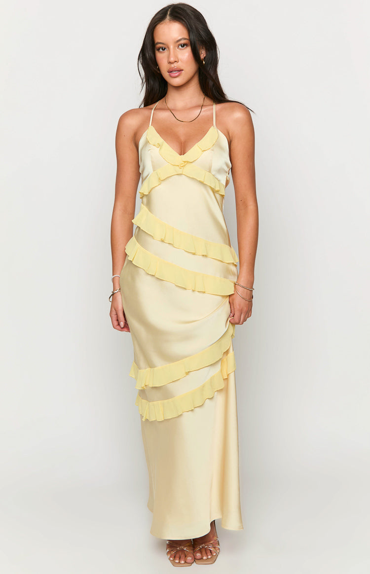 Front view of a pale yellow satin maxi dress with a V-neck and brighter yellow tiered ruffles