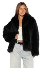 Black faux fur jacket with wide lapels, open front, and relaxed fit, showing the fluffy texture
