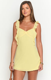 Yellow chiffon mini dress with ruffled shoulder straps and a gathered detail at the sweetheart neckline