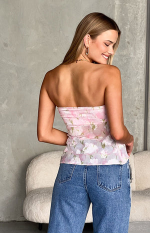 Back view of the sheer pink floral strapless top with subtle gathered detailing