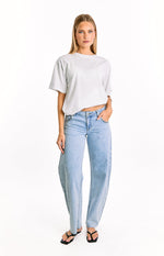 Front view of light wash denim low rise jeans with a relaxed wide leg fit and studded detailing