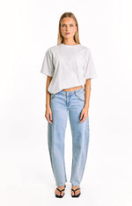 Front view of light wash denim low rise wide-leg jeans with a silver chain detail at the waist