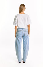 Back view of light wash low rise denim jeans featuring silver stud details on the waistband and back pockets
