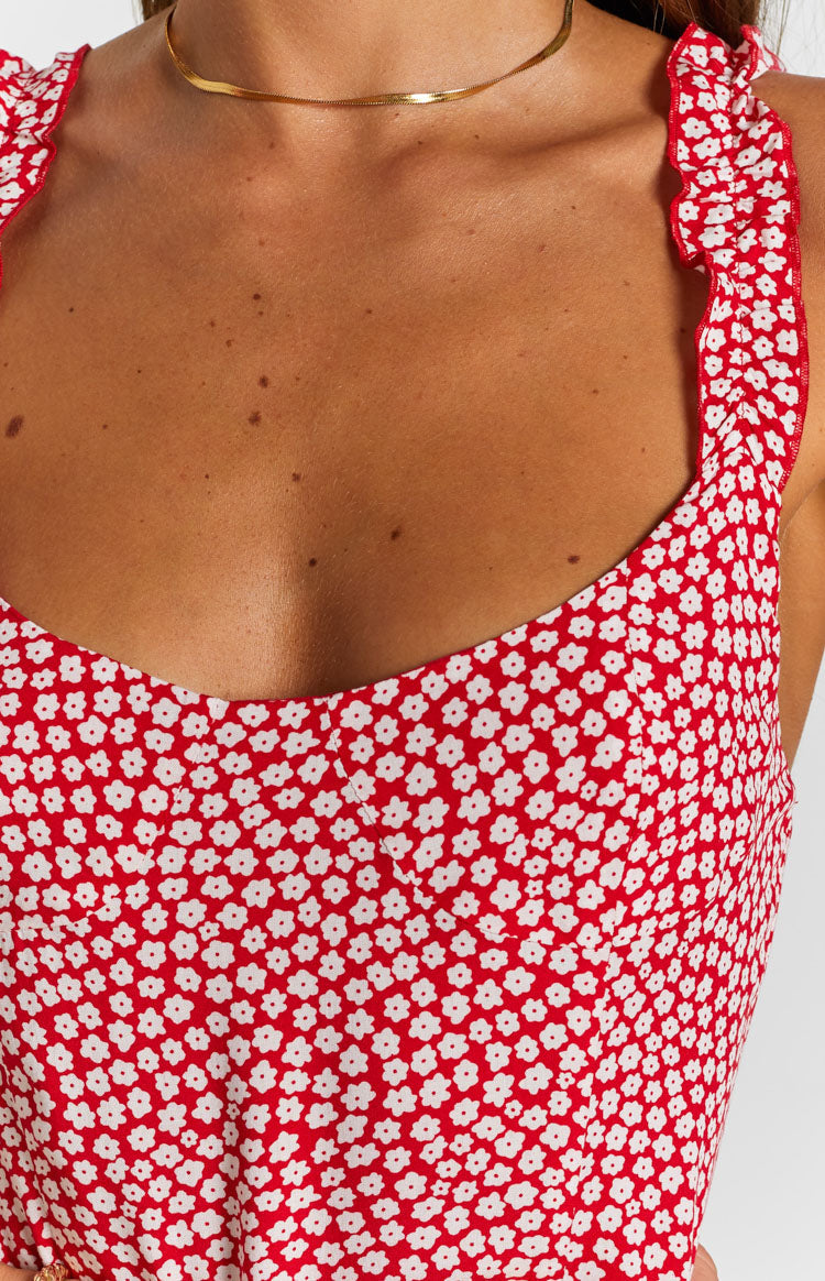 Red midi dress with white floral print, sweetheart neckline, ruffled shoulder straps, and high side split