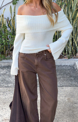 Beginning Boutique Joey Cream Off Shoulder Sweater cream fuzzy knit off-shoulder sweater with a wide ribbed collar and long f