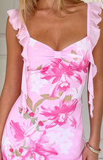 Pink floral chiffon mini dress bodice showing the sweetheart neckline, central bow, and ruffled straps