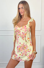 Yellow chiffon mini dress with pink and orange floral print, a sweetheart neckline, and ruffled tie-up shoulder straps