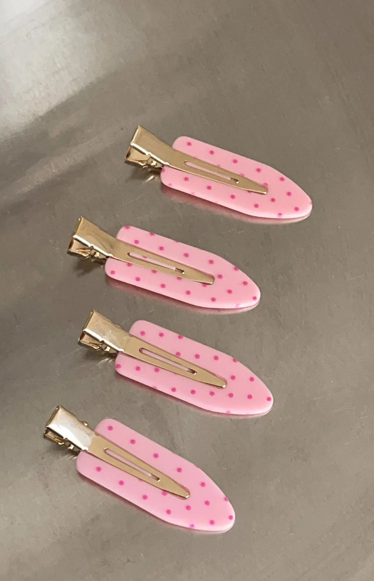 Four pink polka dot non-crease hair clips with gold metal clasps