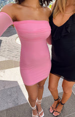 Close-up of a pink off-the-shoulder mini dress with ruched mesh bust and sheer long sleeves