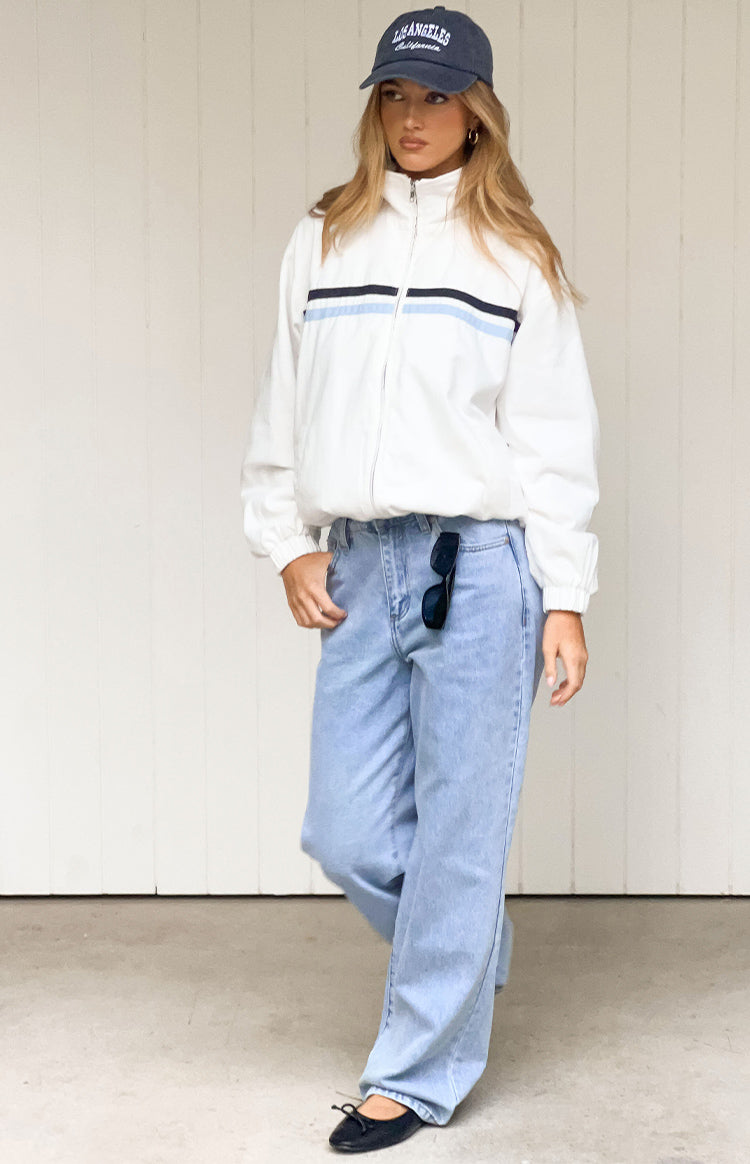 Cream funnel neck jacket with black and light blue contrast stripes and full zip