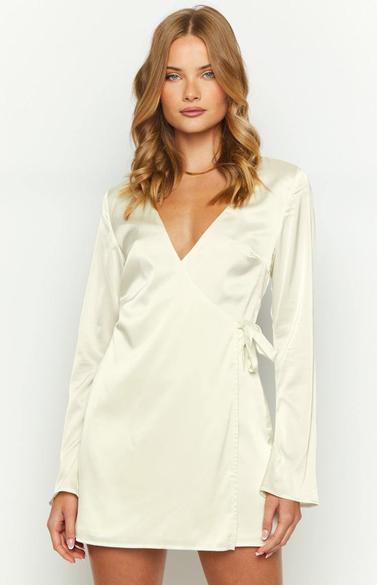 Cream satin long sleeve mini dress with a deep V-neckline and wrap-front tie detail