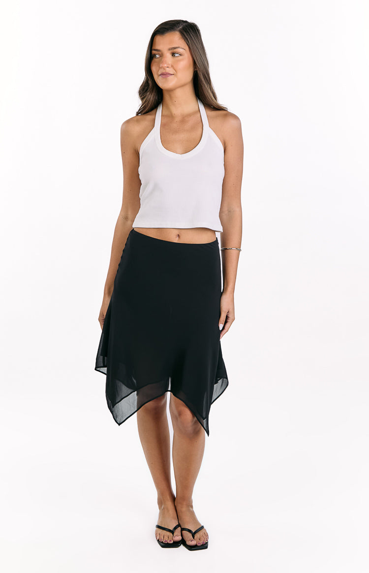 Front view of a black midi skirt with a sheer overlay and an asymmetrical hanky hemline