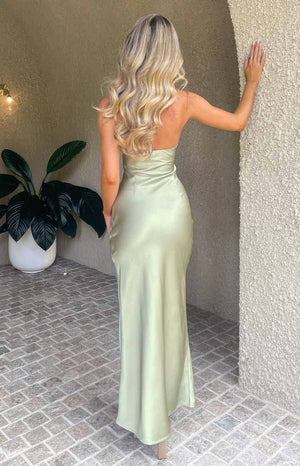Rear-side view of a sage strapless maxi dress with a fitted bodice and a smooth, flowing skirt