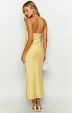 Rear-side view of the yellow satin strapless maxi dress, showing the smooth back and elegant drape