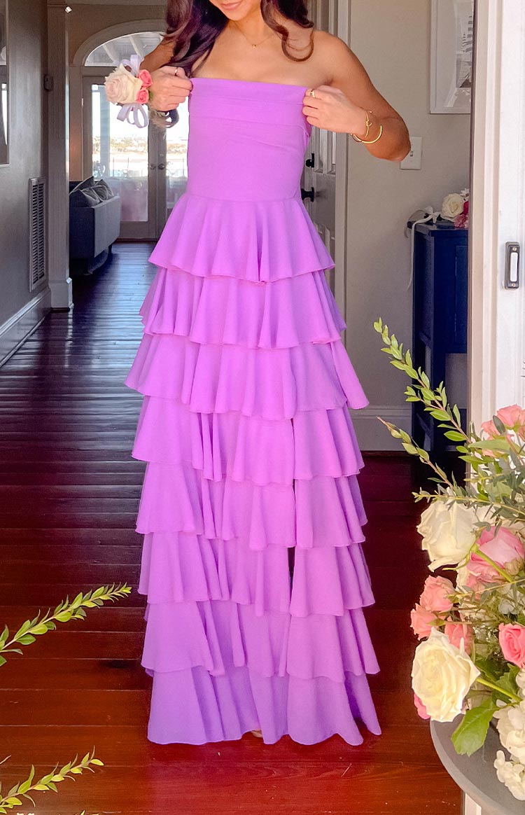 Magenta strapless maxi dress with a ruched bodice and a full tiered ruffle skirt