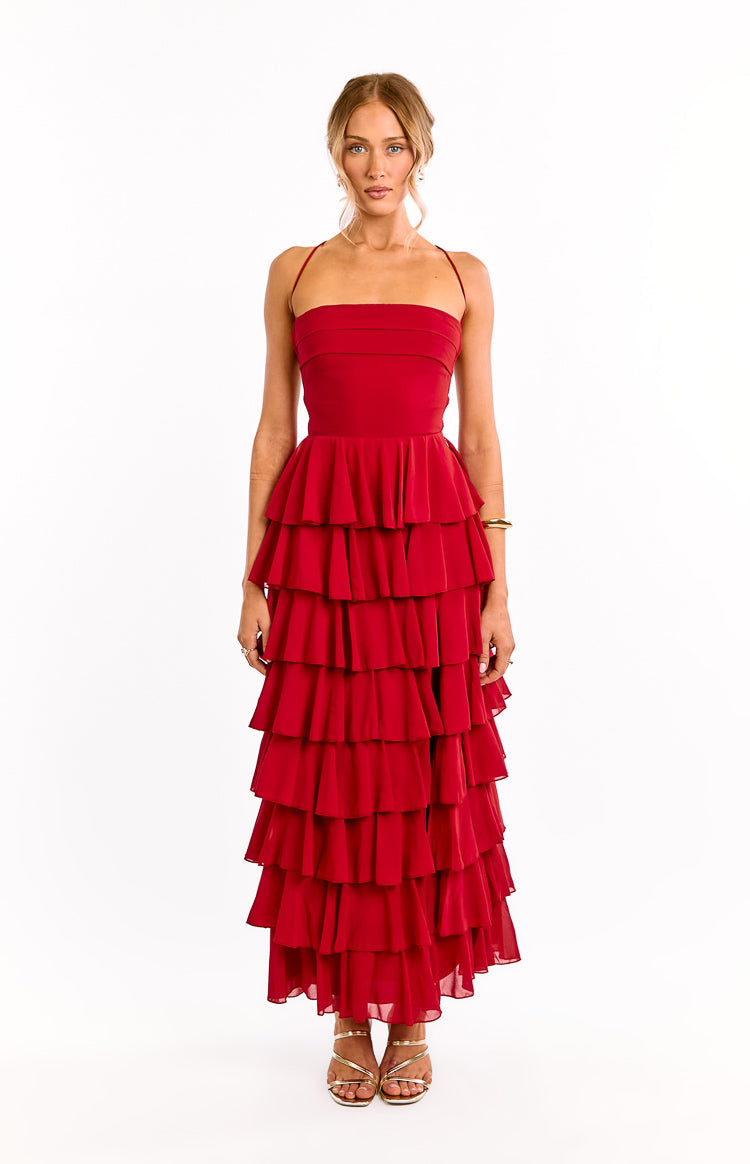 Full front view of a red maxi dress featuring a strapless bandeau bodice, thin halter straps, and cascading tiered ruffles