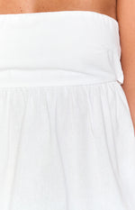 Close-up of the white top showing the gathered waist seam and the textured fabric