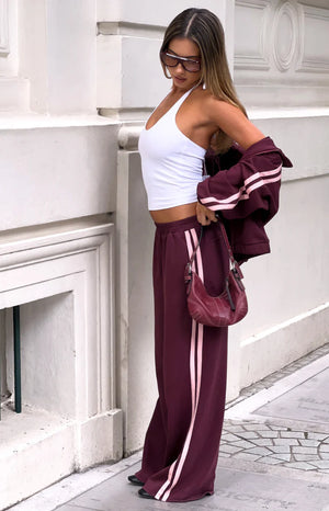 Beginning Boutique Kosie Burgundy and Pink Stripe Track Pants burgundy wide-leg track pants with double pink side stripes