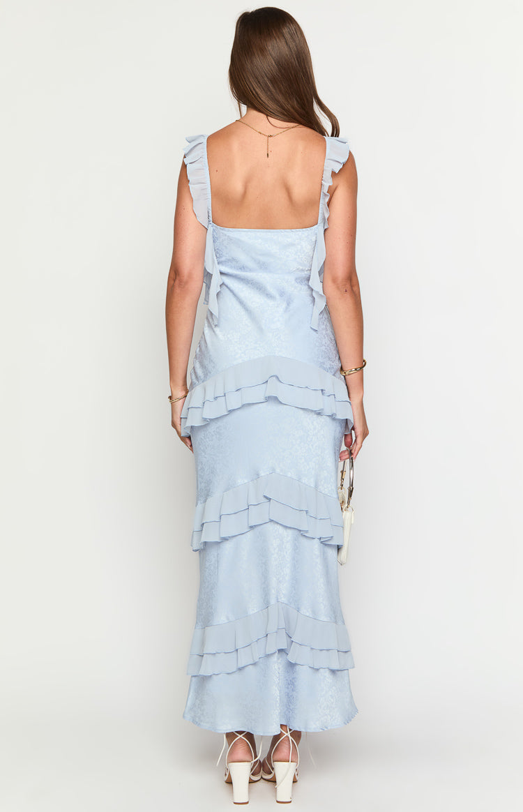 Rear view of a light blue jacquard maxi dress with ruffled straps and tiered ruffles on the skirt