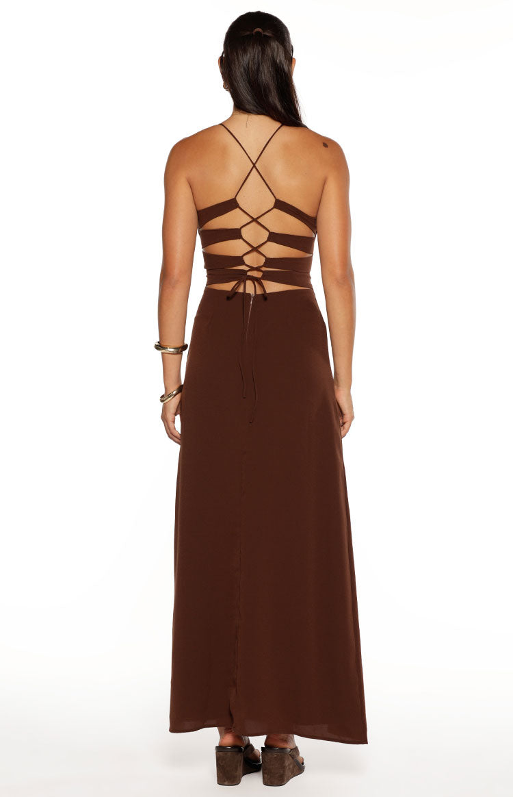 Close-up of the brown maxi dress showing the V-neckline with a small cutout and thin spaghetti strap
