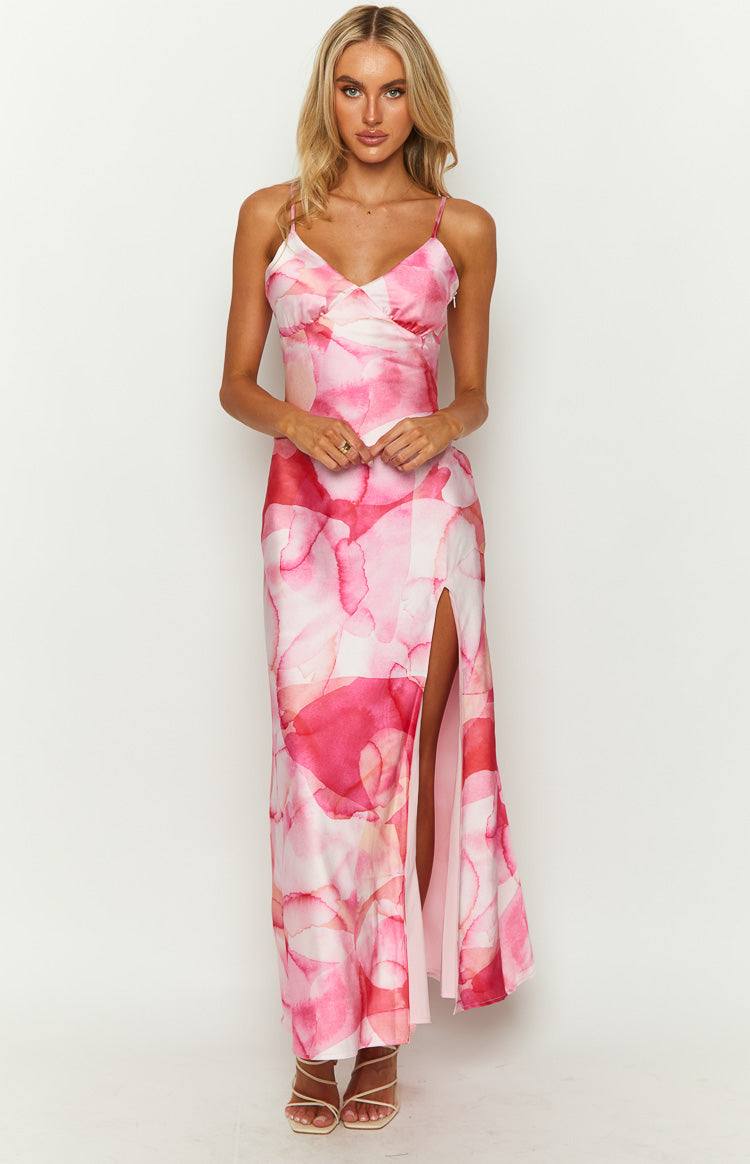 Pink satin watercolor print maxi dress with a V-neckline, spaghetti straps, and a high side slit