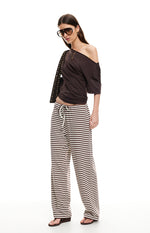 Dark chocolate and white striped wide-leg pants with a white drawstring waist and relaxed fit