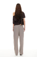 Rear view of dark chocolate and white horizontal striped wide-leg pants with an elasticated waist