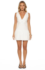 White cotton mini dress with a V-neck broderie bodice, scalloped armholes, and a gathered skirt
