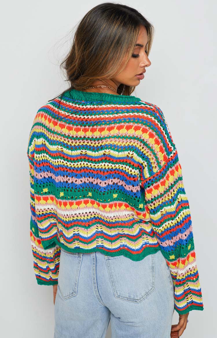 Multi-coloured open knit sweater with horizontal stripes and varied crochet patterns