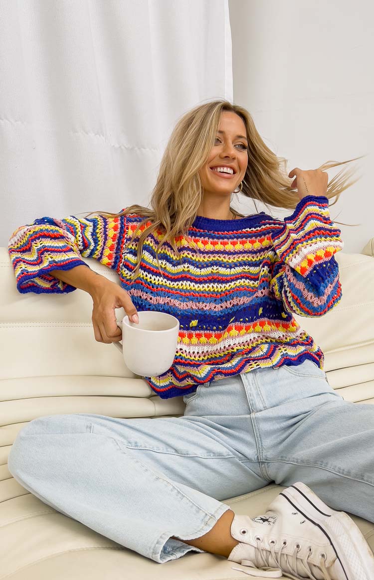 Cropped multi-colour knit sweater with horizontal zig-zag and heart stripes, a crew neck, and long sleeves
