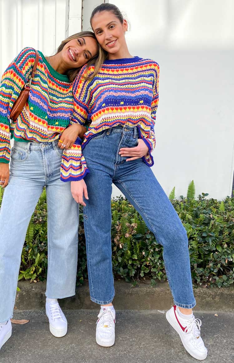 Multi-coloured striped open knit sweater with a crew neck, cropped hem, and long bell sleeves