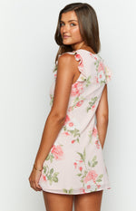 Side view of the pink floral chiffon mini dress with delicate ruffle sleeves