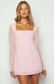 Baby pink mini dress with square neckline, ruched bust, and sheer long sleeves