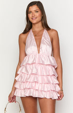 Front view of a pink satin mini dress with a deep V-neck halter and tiered ruffle skirt