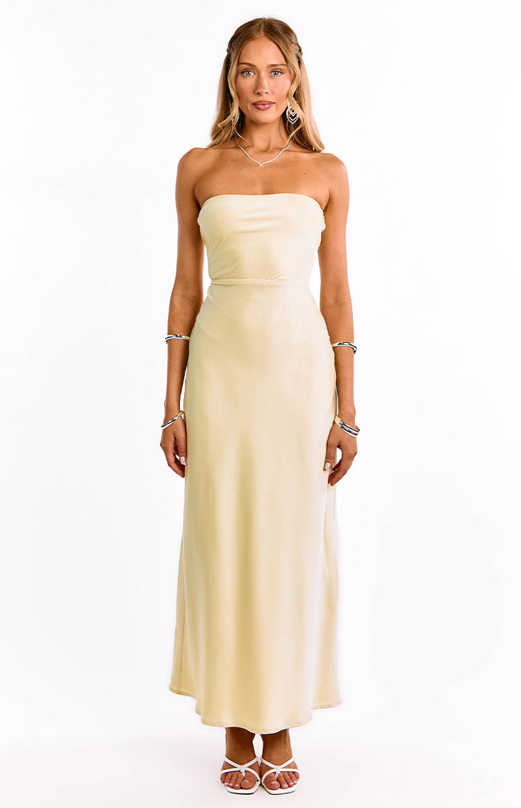 Light yellow strapless formal maxi dress with a straight neckline and a flowing A-line skirt
