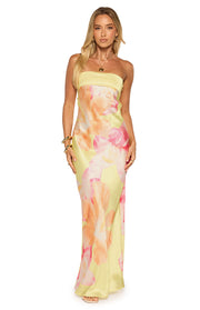 Full-length front view of a yellow strapless maxi dress with large pink and orange hibiscus floral print