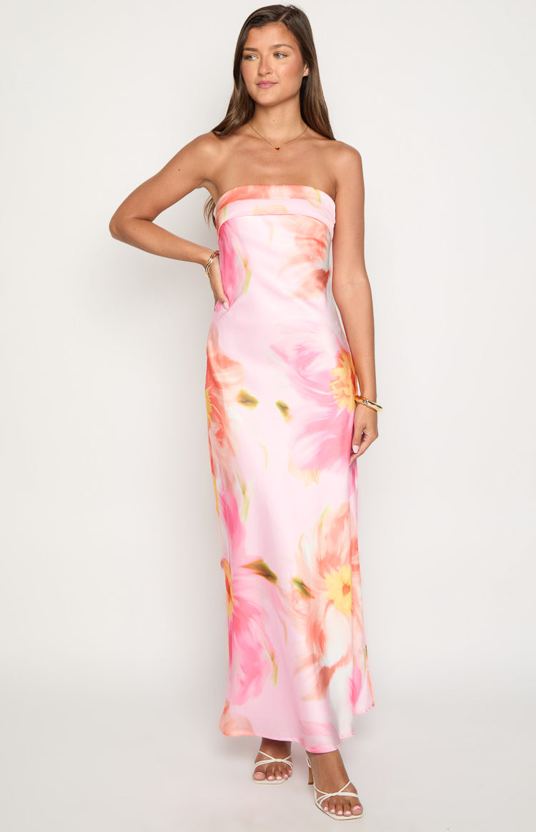 Pink floral print strapless maxi dress with a straight neckline and a long, fluid silhouette