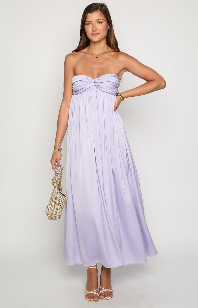 Front view of a lilac strapless maxi dress with a twisted knot detail on the bust and a flowing skirt