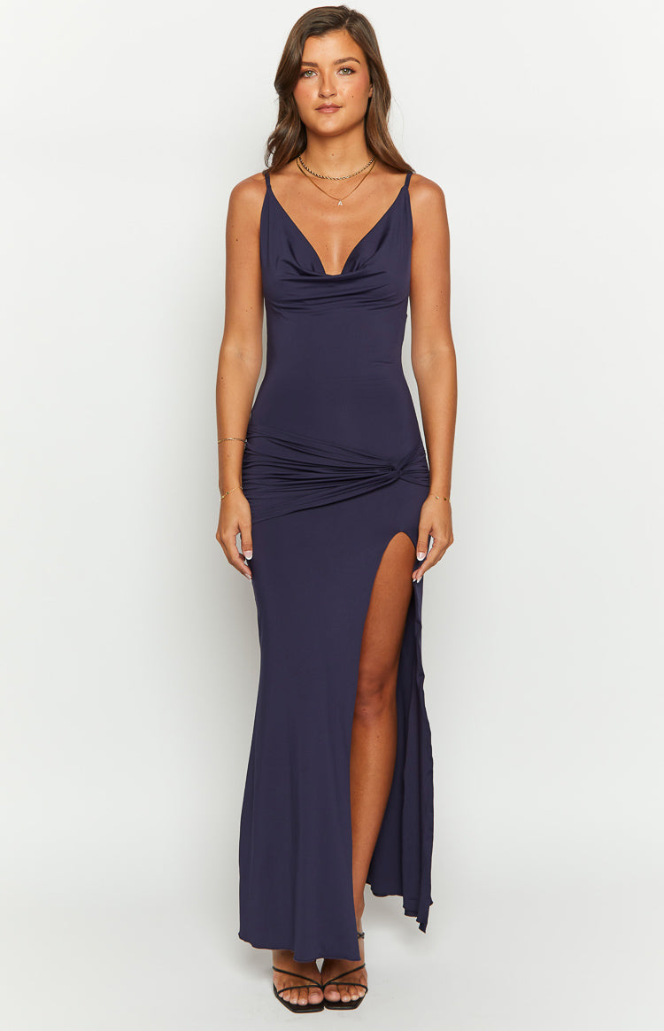 Navy maxi dress with a cowl V-neck, thin spaghetti straps, ruched knot detail at the hip, and a high side split