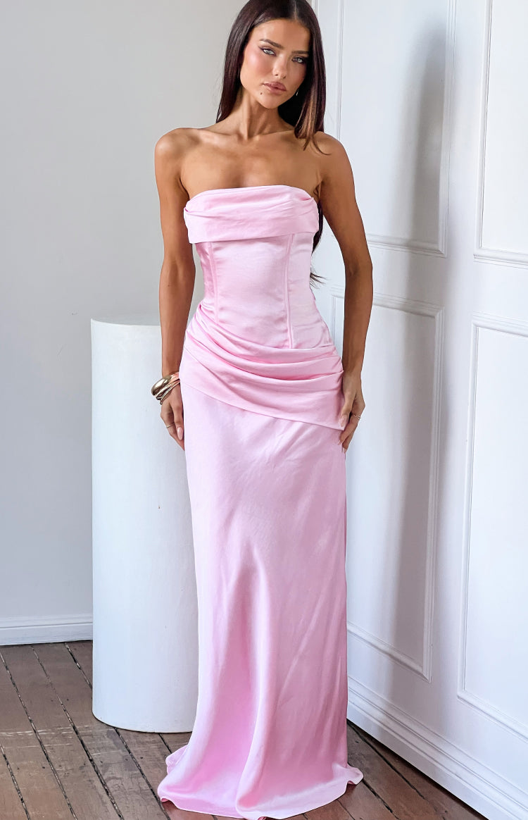 Pink satin strapless maxi dress with a draped neckline, corset-style bodice, and ruched waist detail