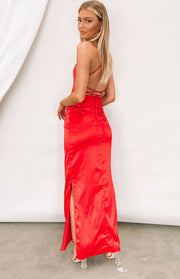 Cherry red satin formal dress featuring a backless design, criss-cross tie straps, and a long side split