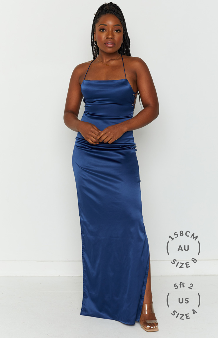 Navy satin maxi slip dress with a square neckline, thin spaghetti straps, and side lace-up detail