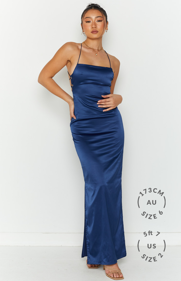 Navy satin formal dress with criss-cross tie-back straps and a long side split