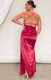 Wine satin formal dress with a low open back, criss-cross straps, tie detail, and a high side slit