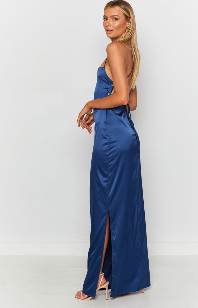 Navy satin maxi dress with thin straps, low lace-up back, and side split